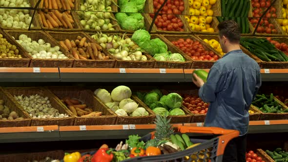 Guy Buys Napa Cabbage at the Supermarket