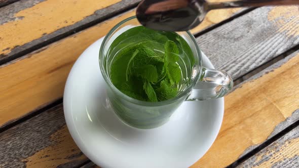 Fresh mint tea with leaves outdoors