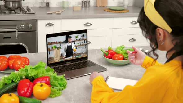 Man Chef Teacher in Laptop Screen Greets Tells Removes Vegetables From Paper Bag