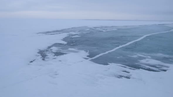 Snowstorm on Clear Ice Surfaces