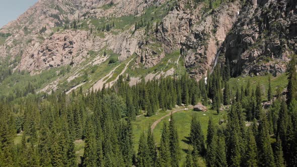 Burkhan Bulak Waterfall in the Mountains in Central Asia