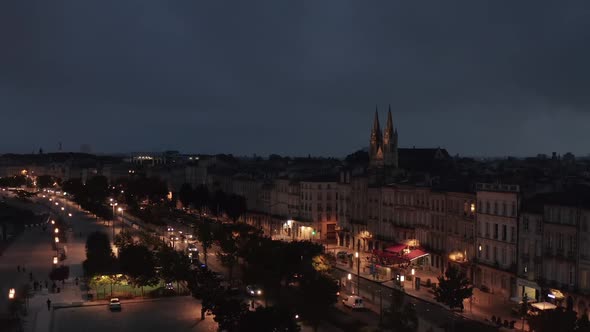 Bordeaux at Night with View of Saint-Louis-des-Chartrons Church, Slow Establishing Aerial