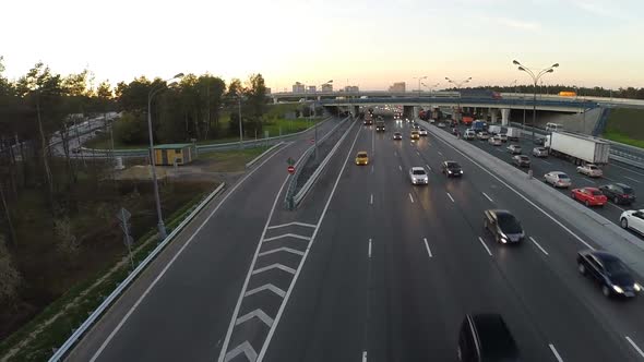 Flying over the city highway in the evening