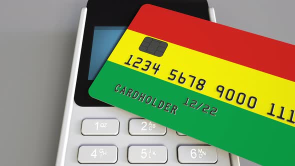 Paying with Bank Card with Flag of Bolivia alt