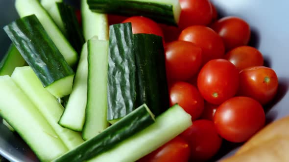 Raw vegetable, tomatoes and loaf of bread