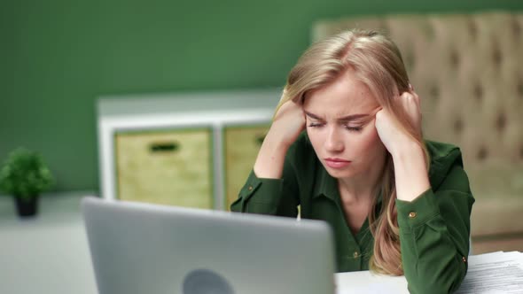 Stressed Girl Feel Migraine Holding Head Watching at Notebook