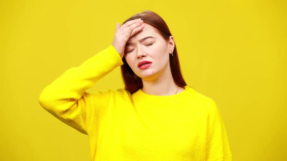 Upset Young Woman Touching Forehead with Hand and Shaking Head in Slow Motion