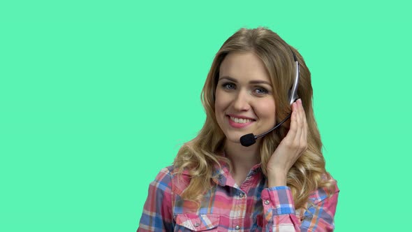 Portrait of Beautiful Call Center Operator on Color Background