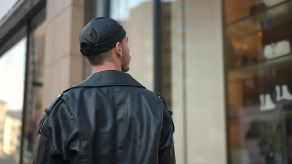 Live Camera Follows Confident Gay Man Window Shopping in Urban City Outdoors