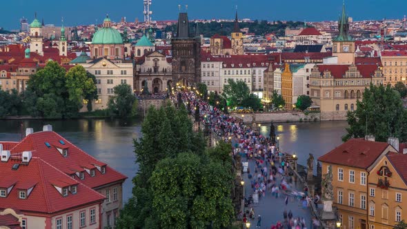 Aerial View of the Old Town Architecture and Charles Bridge Over Vltava River Day to Night Timelapse