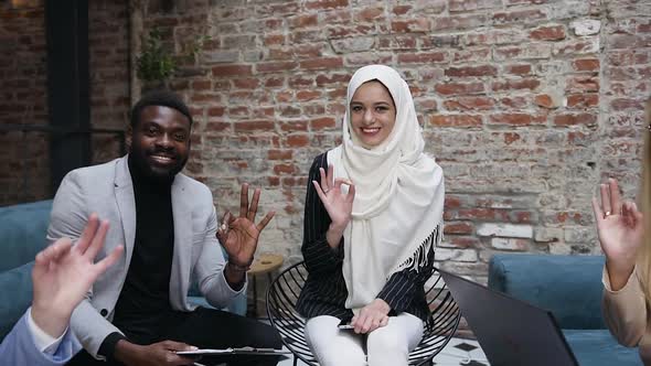 Smiling Young Successful Multi Ethnic Business People Making Gesture OK