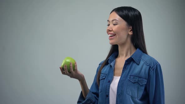 Attractive Woman Posing With Juicy Apple on Grey Background Healthcare, Template