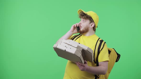 Portrait of Young Men Talking on Phone Drops Pizza Box and is Very Upset