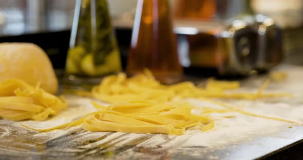 Cook Preparing Pasta in Kitchen