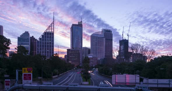 Timelapse of a cloudy and colourful sunset over Sydney traffic, Australia