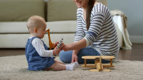 Baby Girl Playing Together with Mom