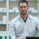 Portrait of young male pharmacist looking at camera and smiling - VideoHive Item for Sale
