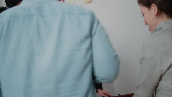 Close Up of Sad Woman Losing Game at Foosball Table