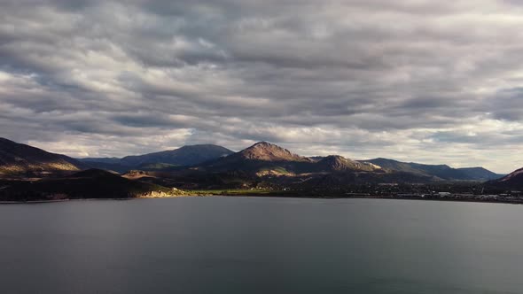 Tranquil Scenery of Egirdir Lake and Mountain Range on the Shore Next to Small Village