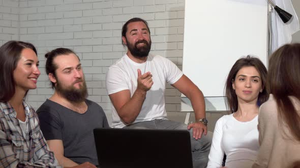 Business Team Applauding During Meeting at the Office