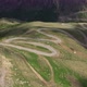 Cars passing through curve in mountainous road. Mountain serpentine road - VideoHive Item for Sale