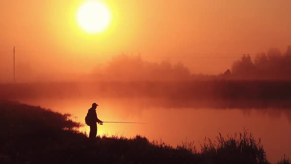 Dawn on the Lake with a Fisherman and Spinning