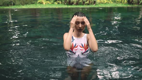 Portrait of Beautiful Young Woman in the Water