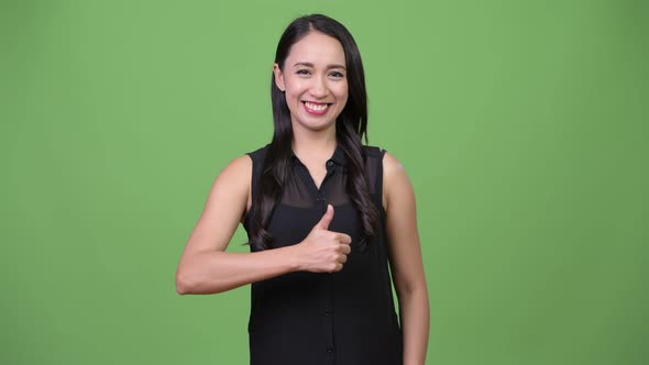 Young Beautiful Asian Businesswoman Giving Thumbs Up