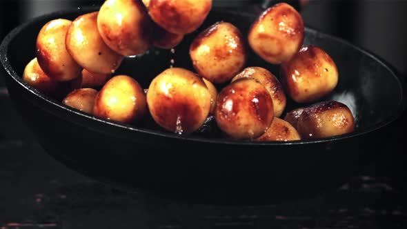 Fried Potatoes are Tossed in a Frying Pan with a Splash of Oil