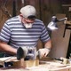 Craftsman Working with Grinding Machine at Wood Workshop. - VideoHive Item for Sale