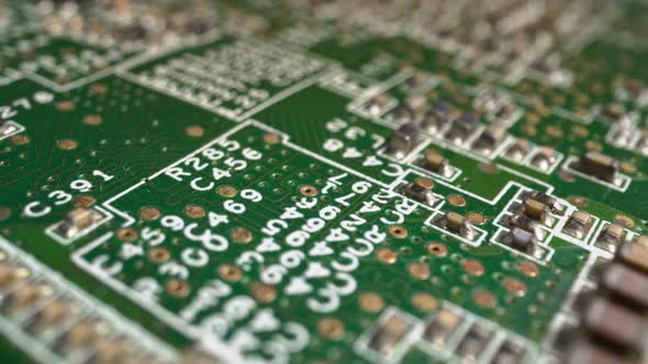 Extreme Closeup of Green Printed Circuit Board Electronics Shot with Dolly