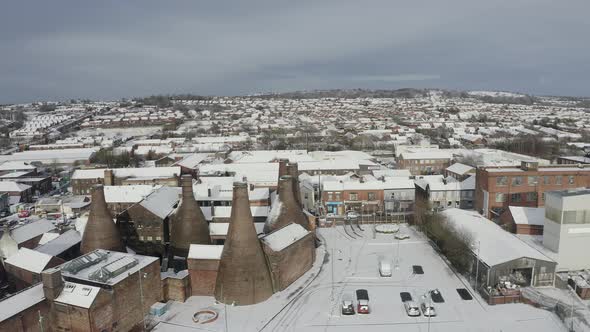 Aerial view of the famous bottle kilns at Gladstone Pottery Museum, covered in snow on a cold winter