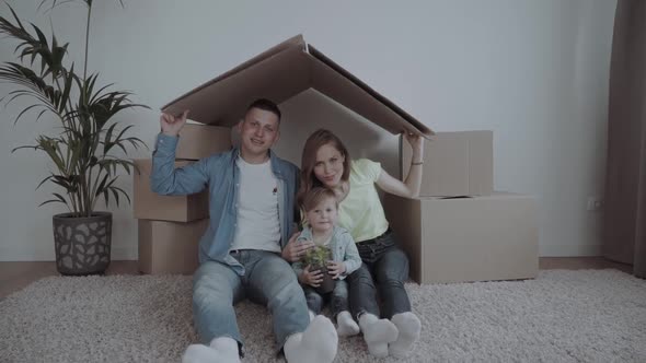 A Happy Family Moves To a New Apartment.