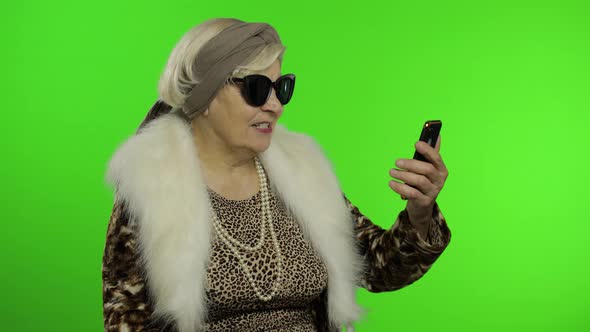 Elderly Caucasian Grandmother Use Smartphone for Talking Video Call. Chroma Key