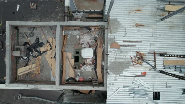 Top Aerial View of a Construction Site on the Roof of a Tall Building