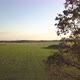 Aerial Cinematic Clip Drone Flying Over a Farm Field During Sunset - VideoHive Item for Sale