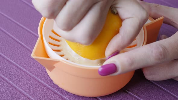 Manual citrus juicer used for healthy drink close-up 3840X2160 UltraHD footage - Lemonade extractor 