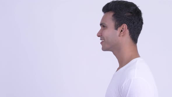 Profile View of Happy Young Indian Man Talking