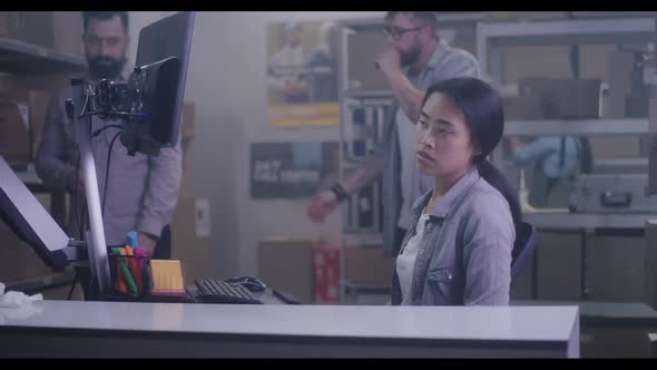 Worker Handling Packages in Warehouse