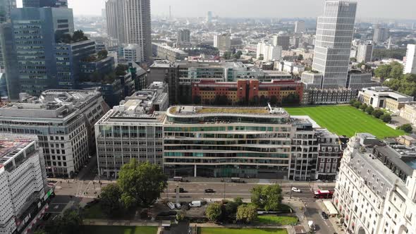 Flying over Finsbury Park, panning up to reveal Barbican Estate on a hazy day in London