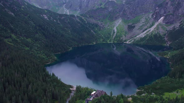 view of the blue mountain lake from a quadcopter morskie oko landmark of poland tatras buried europe