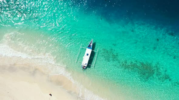 Aerial flying over sky of paradise tourist beach voyage by blue ocean with bright sand background of