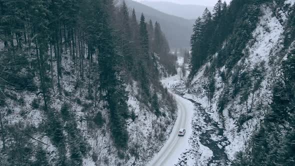 Suv Car Moving Forward By Snowed Mountain Canyon