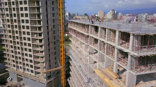construction site of residential building with workers. monolithic construction.