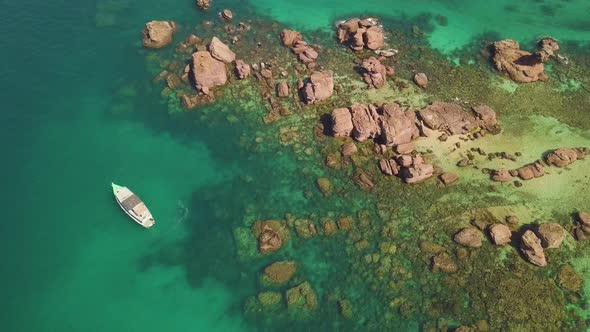 Top Aerial View of Rocky Islands with Coral Reefs and Turquoise Blue Clear Water