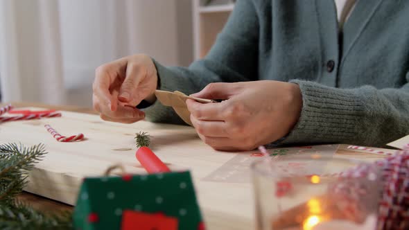 Hands Making Advent Calender on Christmas at Home
