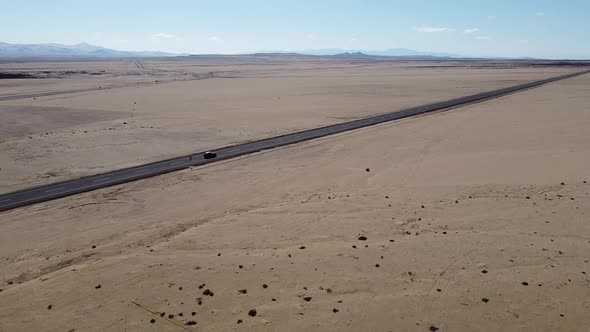 Drone Approaching Car on a Desert Road, Atacama Region, Chile.