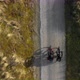 Man and woman riding bikes on dirt road, Nes, Friesland, Netherlands - VideoHive Item for Sale