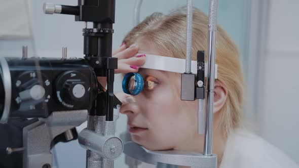 Ophthalmologist Examining the Eyesight of Woman with a Slit Lamp