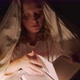 Woman Reads Book Under Blanket in the Dark and Illuminates the Pages of the Book with Flashlight - VideoHive Item for Sale
